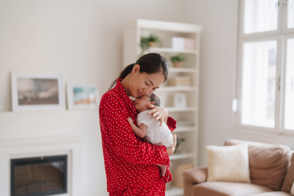 Mother holding baby representing life after choosing pregnancy at Sienna Women’s Center.